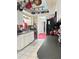Bright kitchen with white cabinets, gray countertop and vintage decor at 4363 Sansedro St, Port Charlotte, FL 33948