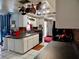 A well-lit kitchen with tile floor, white cabinets and gray countertops at 4363 Sansedro St, Port Charlotte, FL 33948