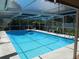 Relaxing screened pool area featuring a beautiful pool, deck space, and outdoor seating at 4363 Sansedro St, Port Charlotte, FL 33948