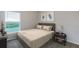 Comfortable bedroom with one bed, a window with natural light, and neutral colors at 5481 Burgner St, Port Charlotte, FL 33981