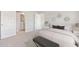 Cozy bedroom with neutral colors, a comfortable bed, and an ensuite bathroom at 5481 Burgner St, Port Charlotte, FL 33981