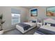 Comfortable bedroom with two beds, a window with natural light, and neutral colors at 5481 Burgner St, Port Charlotte, FL 33981