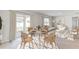 Bright living room featuring an open floor plan, modern furniture, and a sliding glass door to the yard at 5481 Burgner St, Port Charlotte, FL 33981