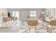 Bright living room featuring an open floor plan, modern furniture, and a large sofa at 5481 Burgner St, Port Charlotte, FL 33981
