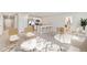 Bright living room featuring an open floor plan, modern furniture, and a kitchen with a breakfast bar at 5481 Burgner St, Port Charlotte, FL 33981