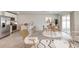 Bright living room featuring an open floor plan, modern furniture, and a kitchen with a breakfast bar at 5481 Burgner St, Port Charlotte, FL 33981