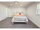 Bright bedroom with new floors, white trim, large windows, and a comfortable queen-size bed at 1100 Belkton Ave, Port Charlotte, FL 33948