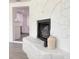 A decorative stone fireplace is visible from the kitchen, showcasing an open floor plan at 1100 Belkton Ave, Port Charlotte, FL 33948