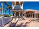 Backyard features a covered patio, outdoor kitchen and hot tub at 17557 Ohara Dr, Port Charlotte, FL 33948