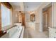 Luxurious bathroom features a soaking tub, elegant fixtures, and marble countertops at 17557 Ohara Dr, Port Charlotte, FL 33948