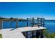 Private boat dock and lift extending into tranquil waters, perfect for waterfront living and boating at 17557 Ohara Dr, Port Charlotte, FL 33948