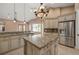 Open kitchen with stainless steel appliances, granite countertops and large center island at 17557 Ohara Dr, Port Charlotte, FL 33948