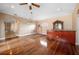 Open living space with hardwood floors, bar, decorative columns and ornate hanging light at 17557 Ohara Dr, Port Charlotte, FL 33948