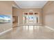 Bright living room with scenic views, offering a seamless indoor-outdoor transition and abundant natural light at 17557 Ohara Dr, Port Charlotte, FL 33948
