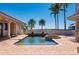 Private pool with brick patio, surrounded by lush landscaping and offering serene waterfront views and privacy at 17557 Ohara Dr, Port Charlotte, FL 33948