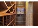 Custom temperature-controlled wine cellar with custom shelves and wood floors at 17557 Ohara Dr, Port Charlotte, FL 33948