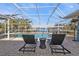 Relax poolside with lounge chairs overlooking the canal in this screened-in outdoor space at 18500 Ohara Dr, Port Charlotte, FL 33948