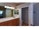 This bathroom features a spacious vanity, ample lighting, and direct access to a toilet room at 5275 Layton Dr, Venice, FL 34293