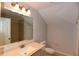 Cozy bathroom with a shower-tub combo, modern vanity, and ample lighting at 5275 Layton Dr, Venice, FL 34293
