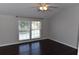 Bedroom featuring dark hardwood floors and a window with natural light at 5275 Layton Dr, Venice, FL 34293