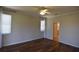 Bright bedroom boasts hardwood floors, ceiling fan and natural light at 5275 Layton Dr, Venice, FL 34293