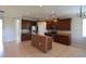 Spacious kitchen features stainless steel appliances, granite countertops, and a central island at 5275 Layton Dr, Venice, FL 34293