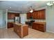 Modern kitchen with stainless steel appliances, granite countertops, and ample cabinet space at 5275 Layton Dr, Venice, FL 34293