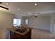 Open kitchen with stainless steel appliances, wooden cabinets, and a center island at 5275 Layton Dr, Venice, FL 34293