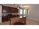 Updated kitchen with stainless steel appliances, wooden cabinets, and a center island at 5275 Layton Dr, Venice, FL 34293