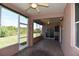 Covered patio, screened in with dual ceiling fans and views of the lawn at 5275 Layton Dr, Venice, FL 34293