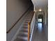 Bright stairway features a wooden handrail and tiled landing at 5275 Layton Dr, Venice, FL 34293