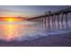 Tranquil sunset view of the fishing pier extending into the ocean at Venice Beach at 5275 Layton Dr, Venice, FL 34293
