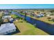 Aerial view of the canal behind the property and the waterfront community at 102 Annapolis Ln, Rotonda West, FL 33947