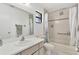 Well-maintained bathroom with a shower-tub combo, neutral tile and a large vanity at 102 Annapolis Ln, Rotonda West, FL 33947