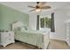 Well lit bedroom featuring a white wood bed frame and a large window with outdoor views at 102 Annapolis Ln, Rotonda West, FL 33947