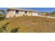 Charming single-story home with a well-manicured lawn and a two-car garage at 102 Annapolis Ln, Rotonda West, FL 33947