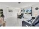Bright and airy living room featuring tile floors, modern furniture, and a large window at 102 Annapolis Ln, Rotonda West, FL 33947
