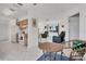 Open-concept living room featuring tile floors with a view of the kitchen and dining areas at 102 Annapolis Ln, Rotonda West, FL 33947
