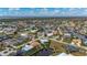 Aerial view of house located on canal with boat lift, surrounded by gorgeous neighborhood at 1380 Willet Ct, Punta Gorda, FL 33950