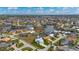 Aerial view of a charming home in a beautiful neighborhood on a canal with a boat lift at 1380 Willet Ct, Punta Gorda, FL 33950
