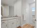 Modern bathroom featuring double vanity, tile floors, and a bright glass shower at 1380 Willet Ct, Punta Gorda, FL 33950