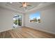 Large bedroom featuring tray ceilings, wood floors, recessed lighting, and water views at 1380 Willet Ct, Punta Gorda, FL 33950