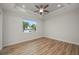Spacious bedroom featuring tray ceilings, wood floors, and recessed lighting at 1380 Willet Ct, Punta Gorda, FL 33950