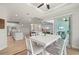 Inviting dining room with an open layout that seamlessly connects the kitchen, living area, and outdoor space at 1380 Willet Ct, Punta Gorda, FL 33950