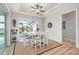 Cozy dining area with natural light, direct access to the pool, and a ceiling fan at 1380 Willet Ct, Punta Gorda, FL 33950