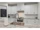 Bright kitchen with white cabinetry, stainless steel appliances, and granite countertops at 1380 Willet Ct, Punta Gorda, FL 33950