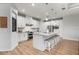 Gourmet kitchen featuring an island with seating, stainless steel appliances, and elegant finishes at 1380 Willet Ct, Punta Gorda, FL 33950