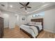 Comfortable main bedroom with tray ceiling, recessed lighting, and wood-look floors at 1380 Willet Ct, Punta Gorda, FL 33950