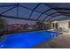 Sparkling screened-in pool overlooking the canal, perfect for relaxation and entertaining, with outdoor dining space at 1380 Willet Ct, Punta Gorda, FL 33950