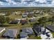 Aerial view of a residential community featuring a mix of homes and natural surroundings at 16305 Branco Dr, Punta Gorda, FL 33955